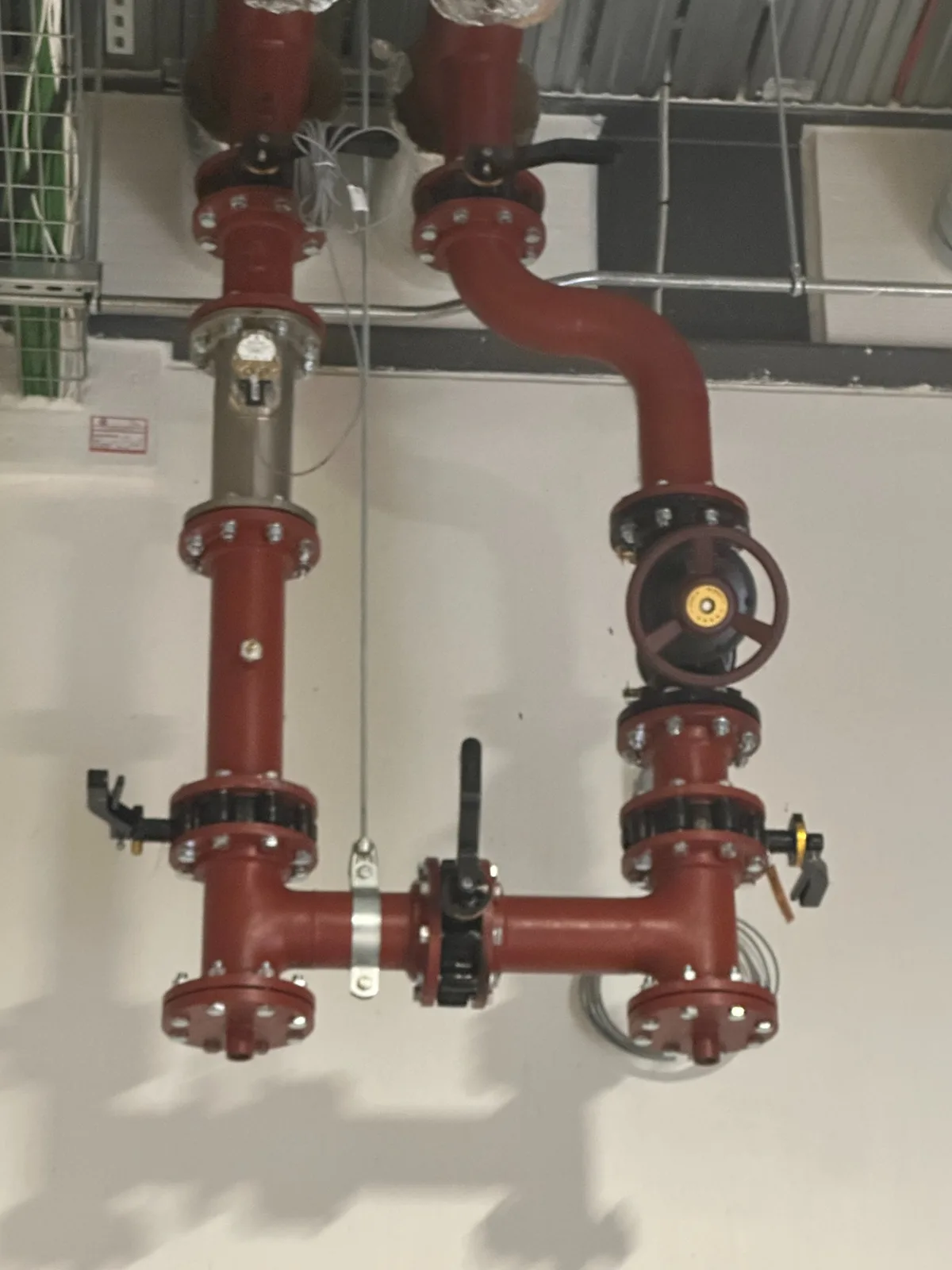Six-inch commercial pipework alterations with valves and high-level distribution