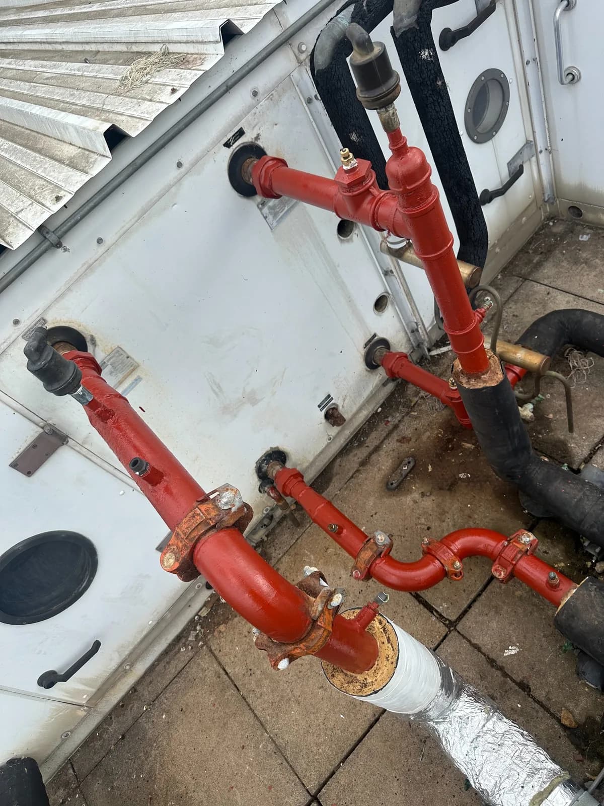 Rooftop mechanical pipework alterations serving air-handling equipment