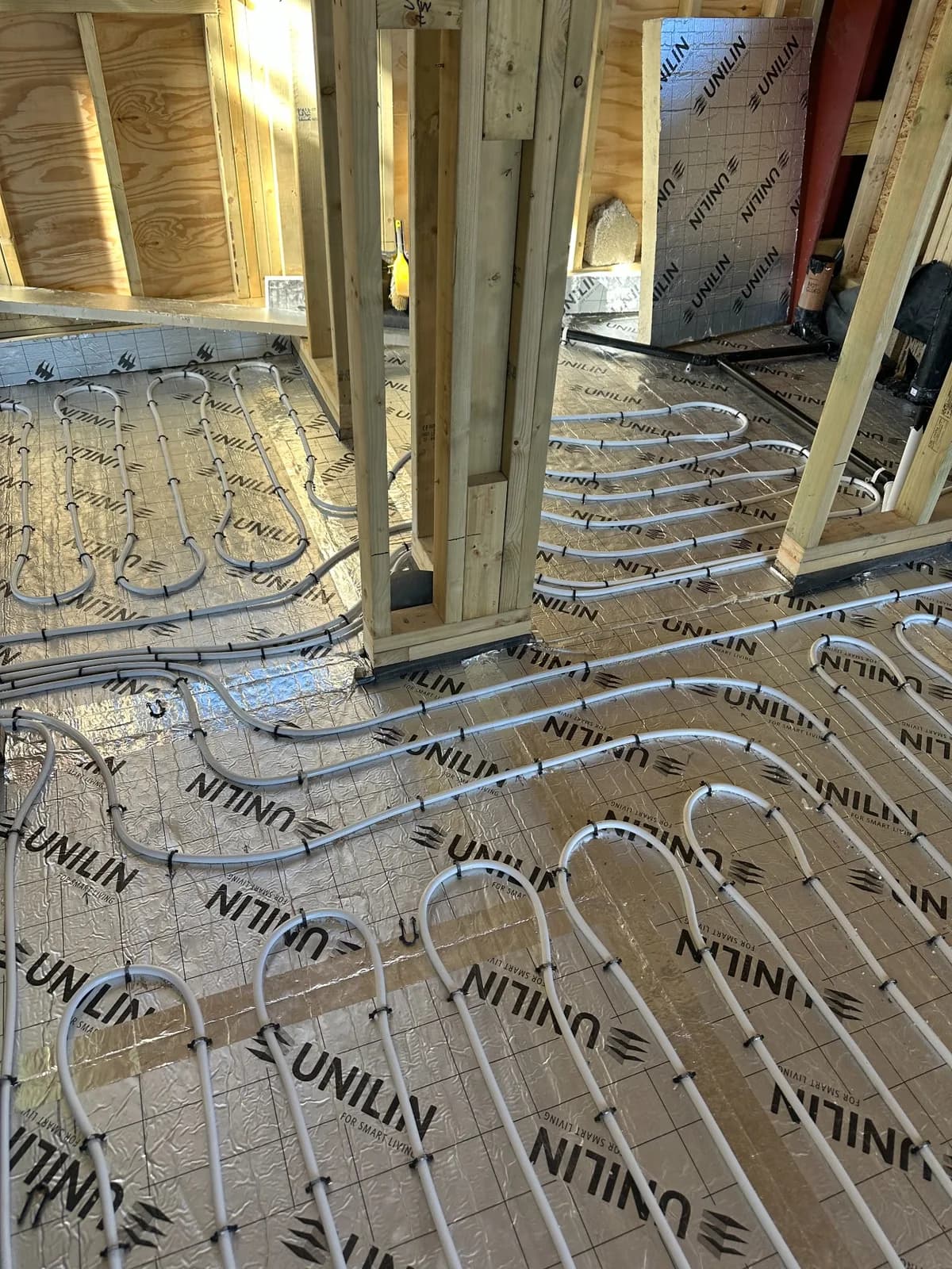 Underfloor heating manifold and multi-zone pipe circuits in an Essex property