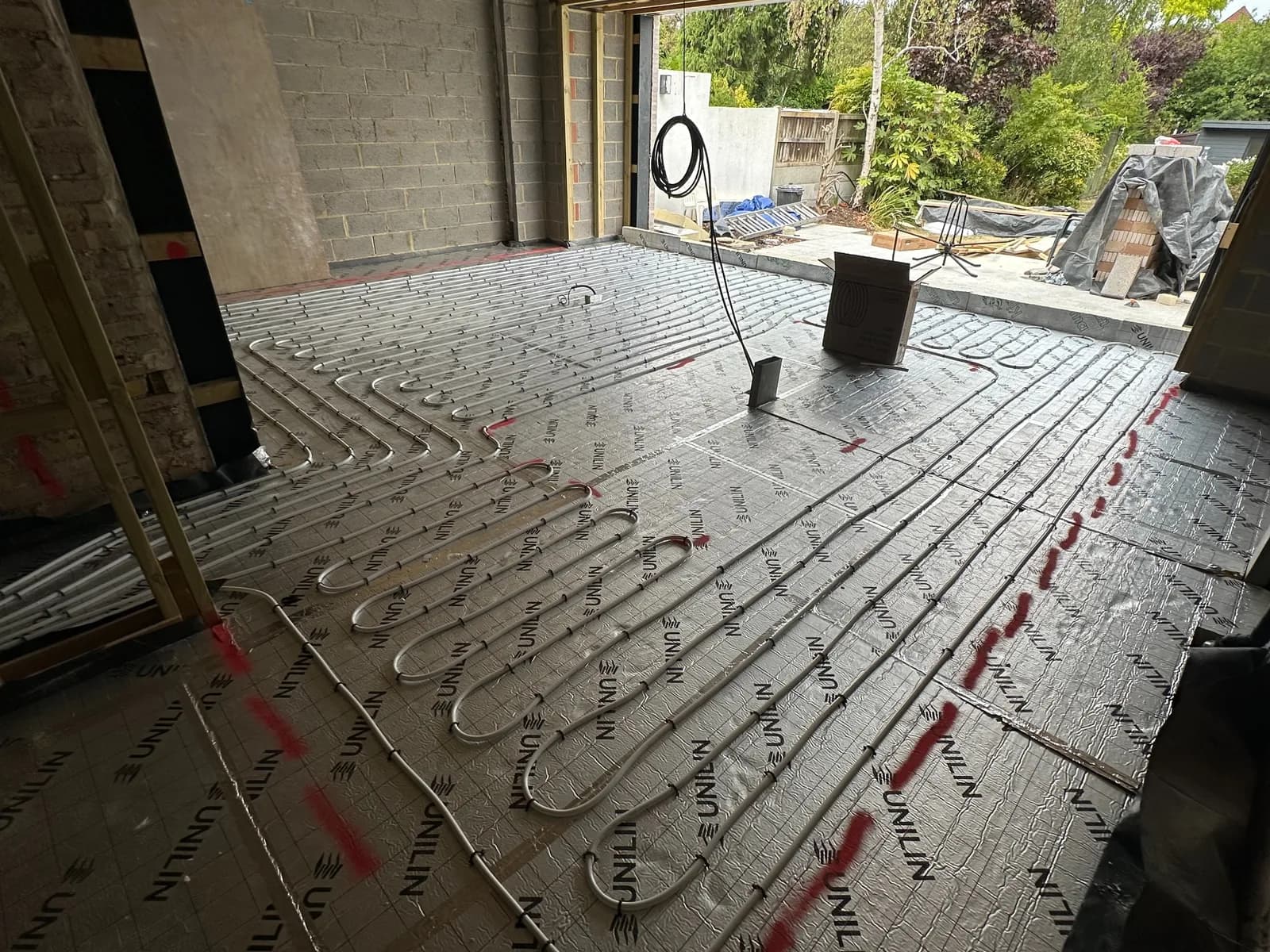 Large open-plan underfloor heating installation in Woodford