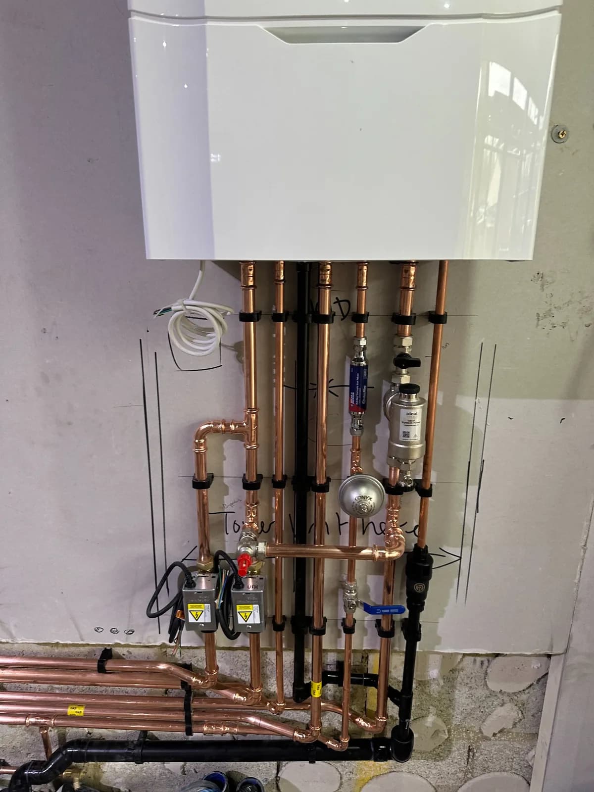 Domestic boiler installation with coordinated copper heating and water pipework